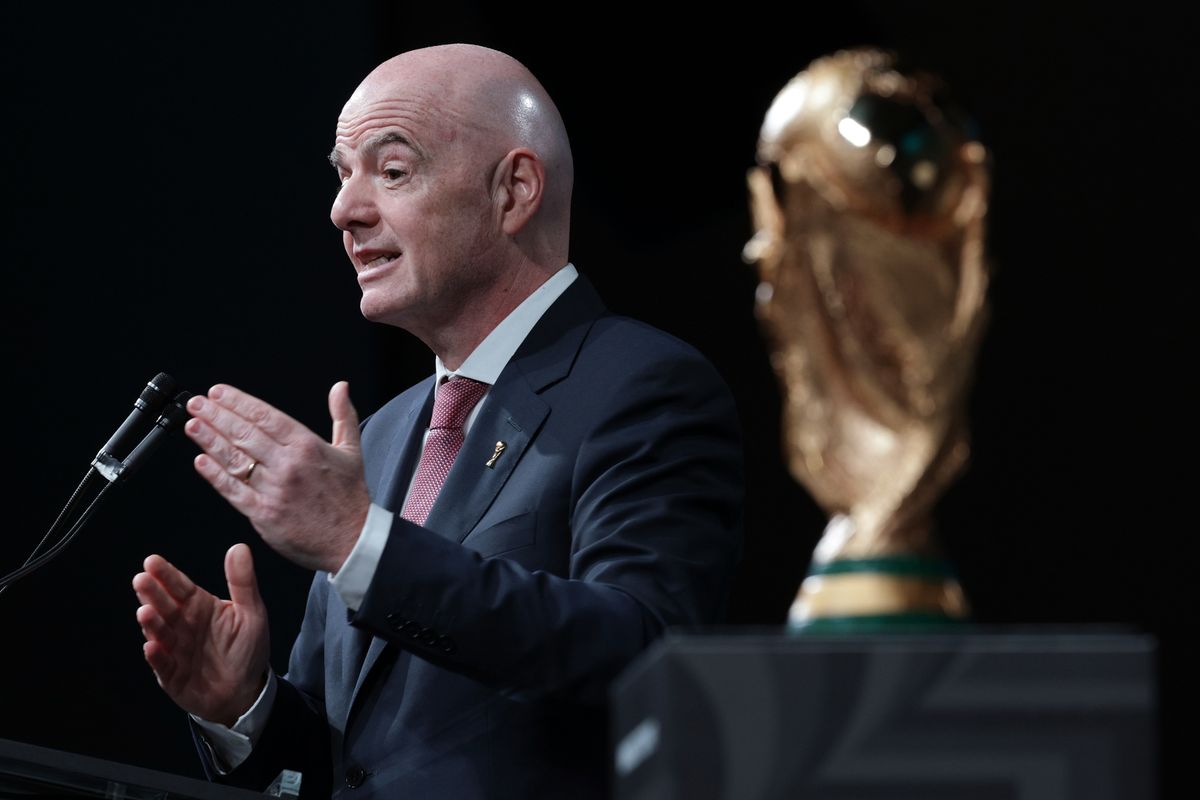 Standing next to the FIFA World Cup Trophy, FIFA President Gianni Infantino