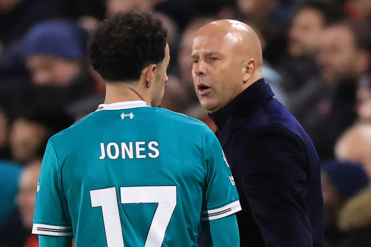 Curtis Jones of Liverpool with head coach Arne Slot