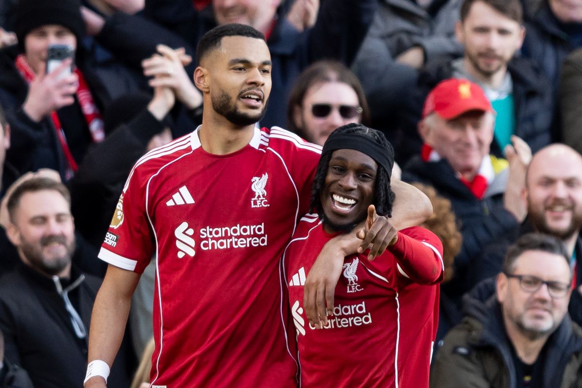 Jeremie Frimpong of Liverpool celebrates with Cody Gakpo after forcing his team's fifth goal in the Premier League match against West Ham United at Anfield on February 28 2026