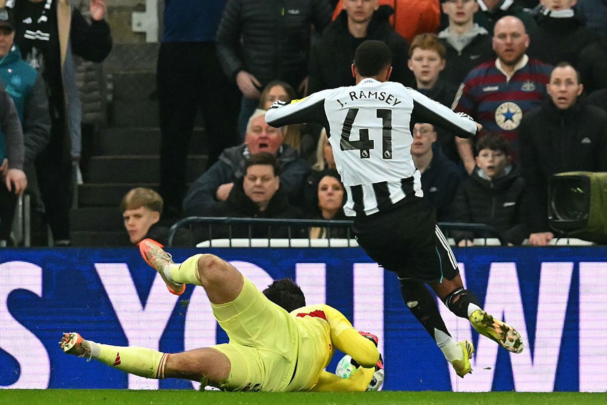 Jacob Ramsey goes down after Manchester United's Belgian goalkeeper Senne Lammens takes the ball from him