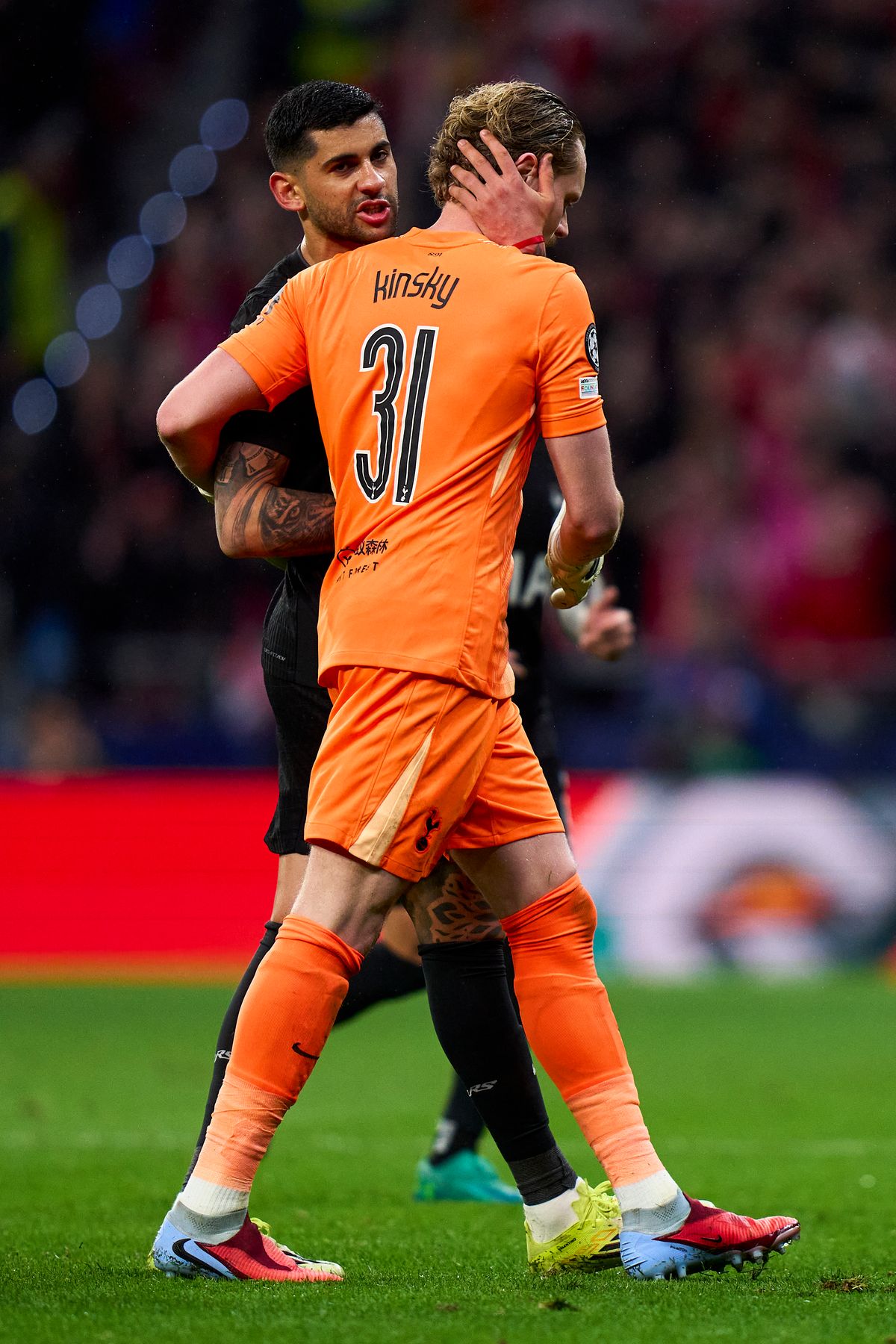 MADRID, SPAIN - MARCH 10: Antonin Kinsky of Tottenham Hotspur FC speaks to teammate Cuti Romero as he leaves the pitch during the UEFA Champions League 2025/26 Round of 16 First Leg match between Atletico de Madrid and Tottenham Hotspur FC at Estadio Civitas Metropolitano on March 10, 2026 in Madrid, Spain. (Photo by Diego Souto/Getty Images)