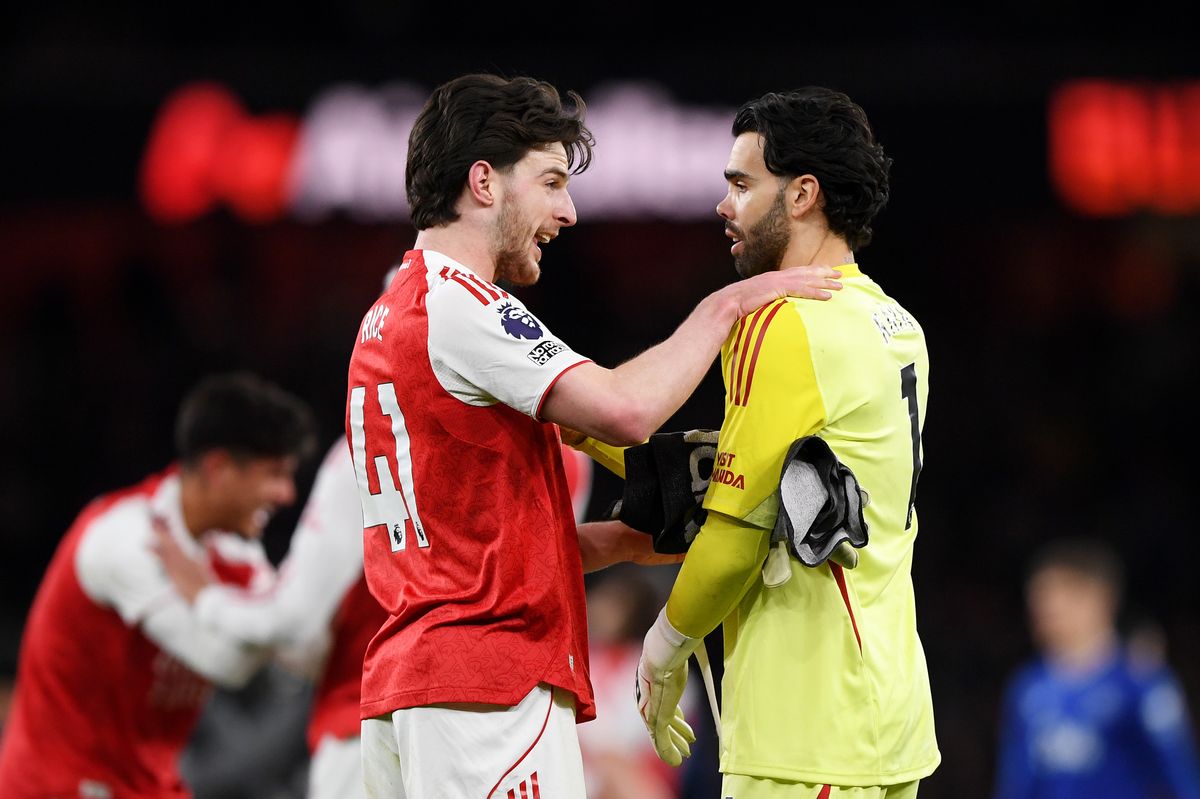Declan Rice and David Raya of Arsenal celebrate the teams victory following the Premier League match between Arsenal and Everton at Emirates Stadium on March 14, 2026 in London, England.
