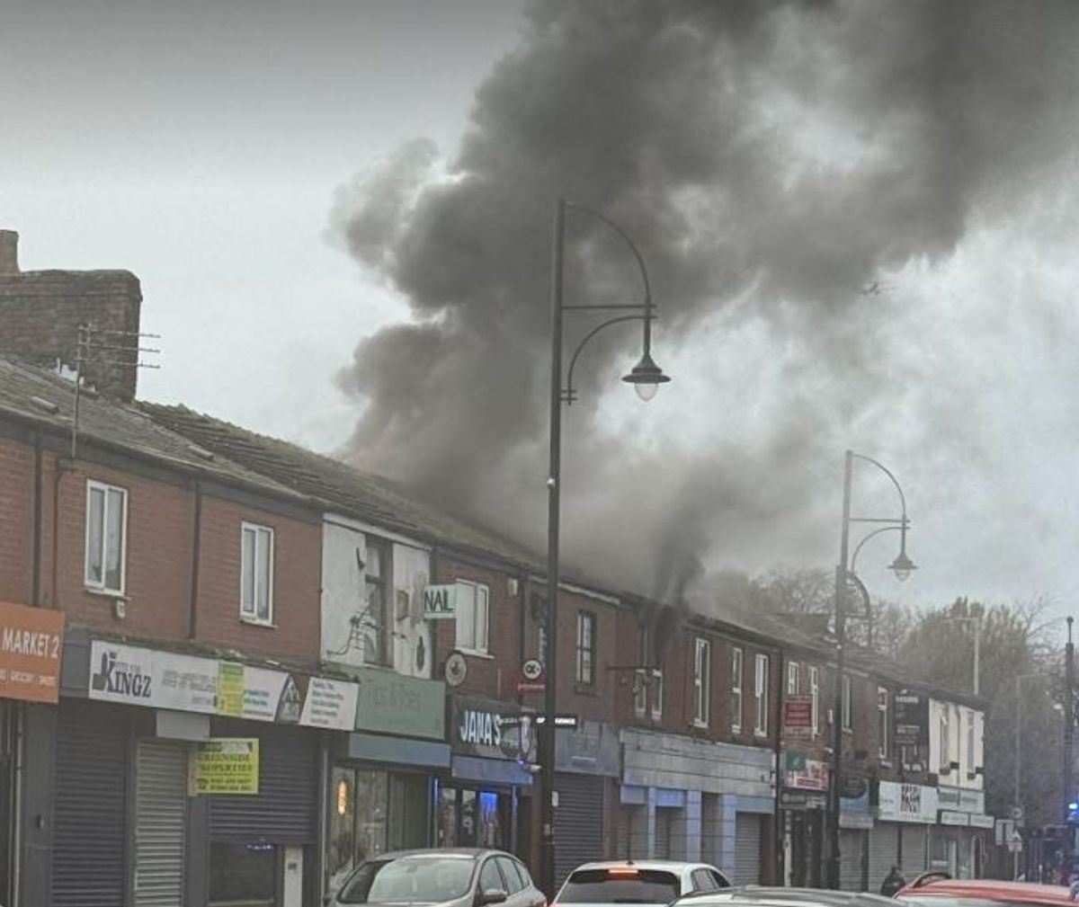 Smoke was seen billowing from the roof of the building in Stockport