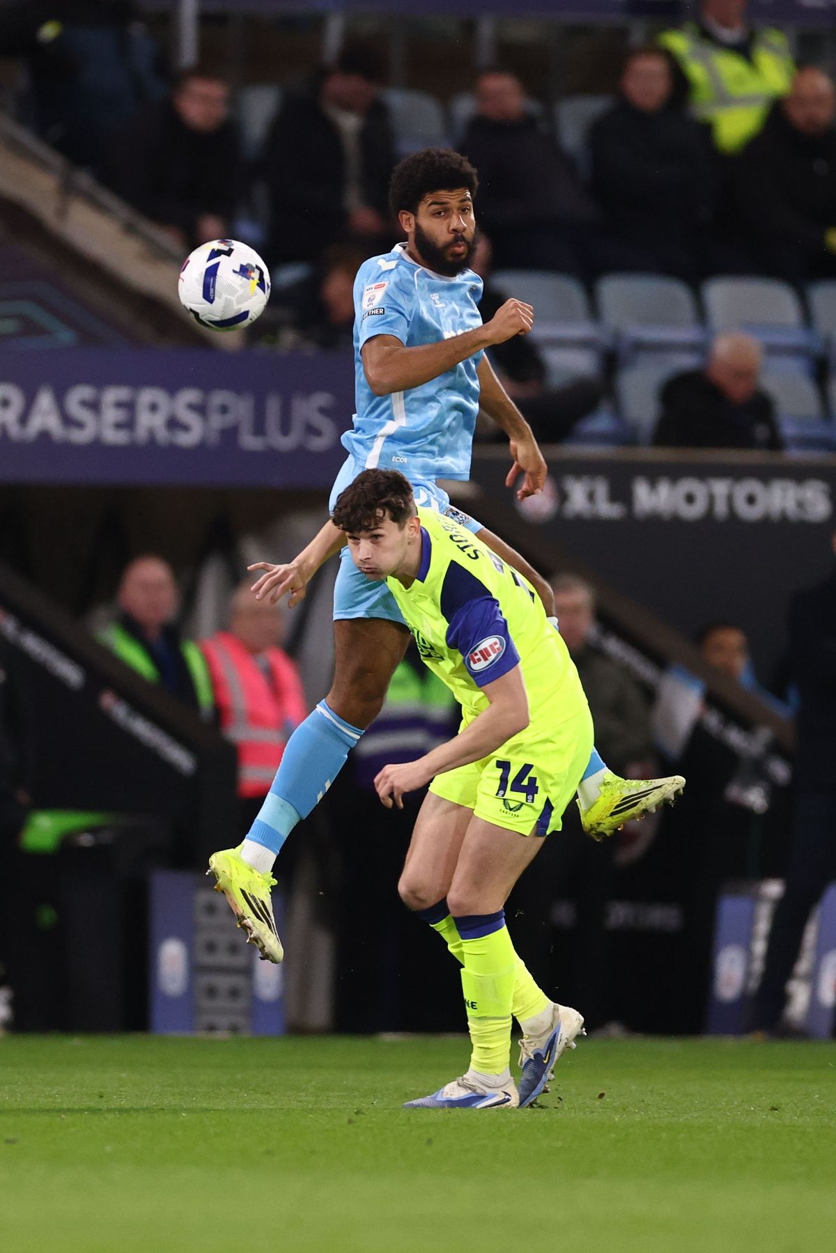 Ellis Simms of Coventry City and Jordan Storey of Preston North End
