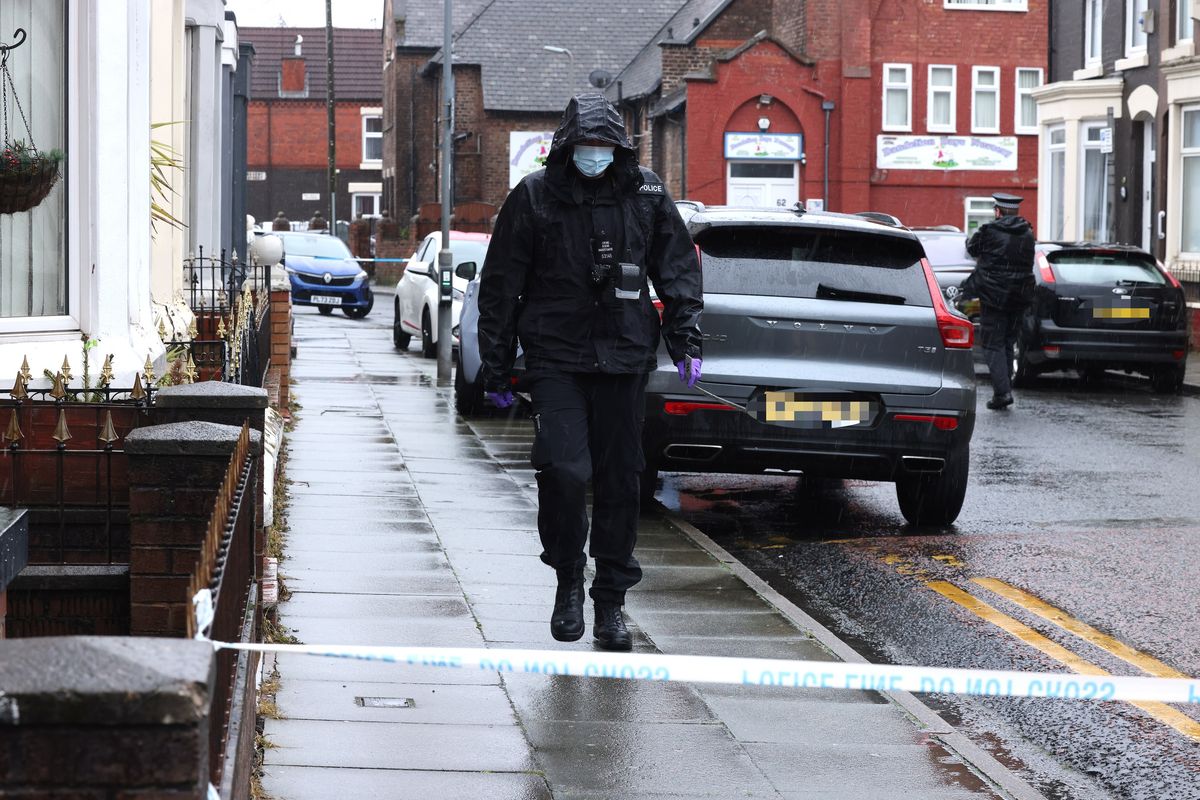 A police forensic officer on Church Road West in Walton today