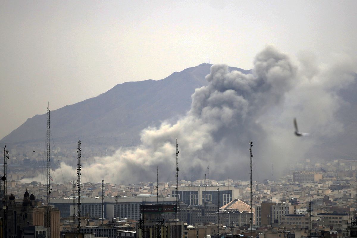 Smoke rises after airstrikes in Tehran, Iran on March 13