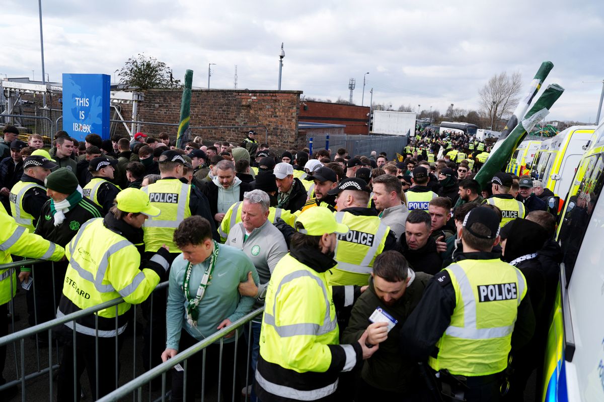 Celtic fans pass the police checkpoint