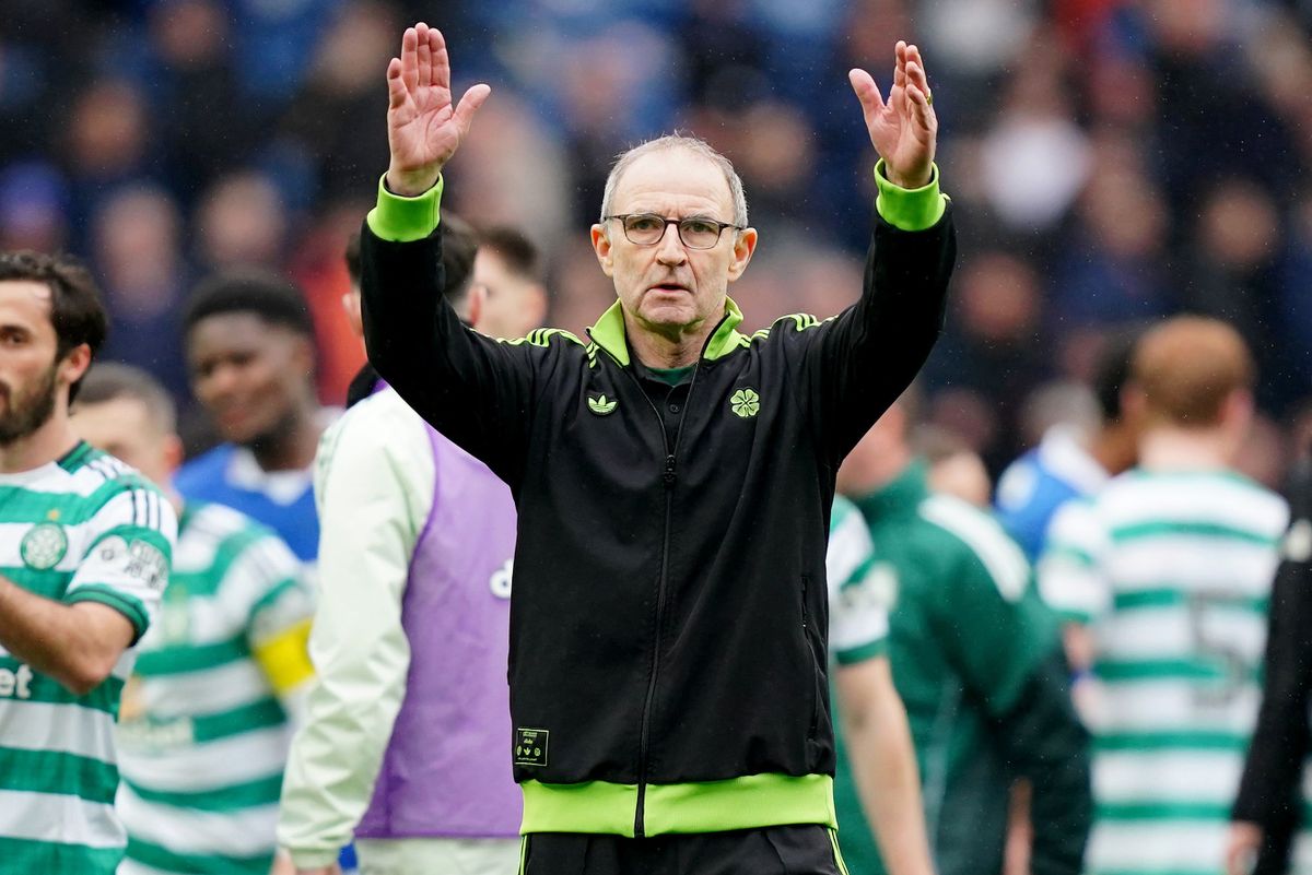 Celtic boss Martin O'Neill salutes the away crowd at Ibrox