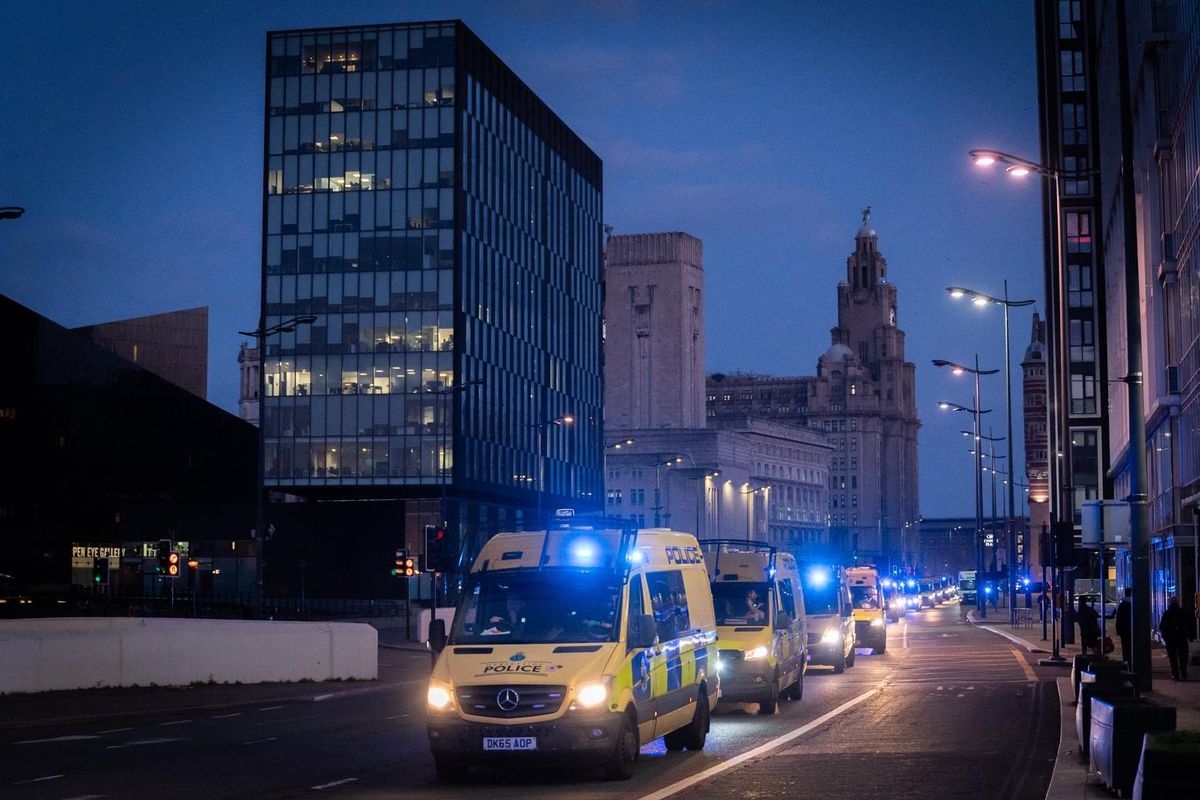 A huge convoy of Merseyside Police vans were seen travelling through Liverpool City Centre this morning