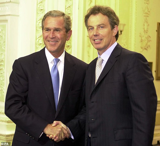 Then-US President George Bush shakes hands with Tony Blair in July 2001