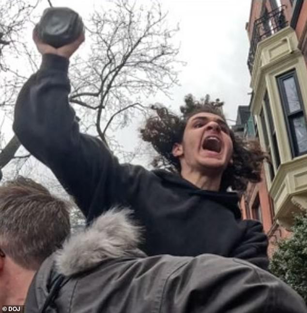 Emir Balat is pictured throwing a homemade explosive device outside the New York City mayor's mansion on Saturday afternoon