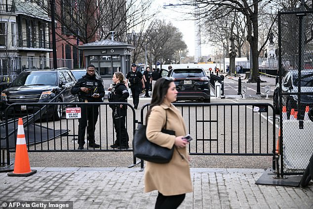 Members of the US Secret Service monitor the scene after a vehicle ran into a security barricade near the White House in Washington, DC, on March 11