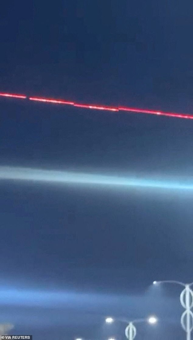 A C-RAM air defence system intercepts drones during reported drone and rocket attacks on the US embassy in Baghdad, Iraq