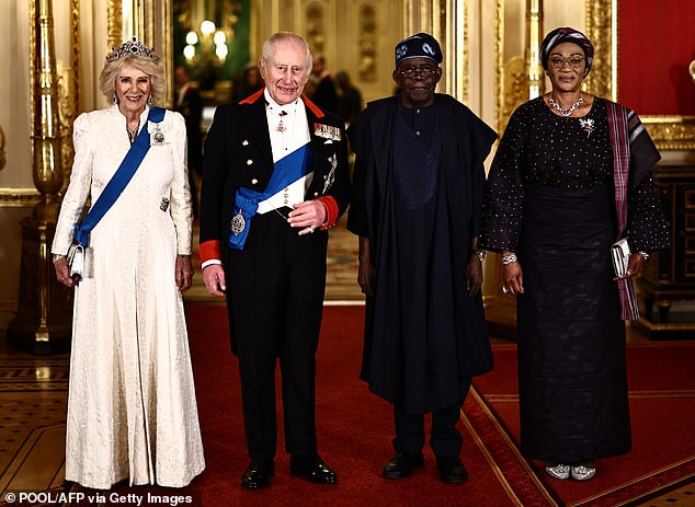 King Charles III, Queen Camilla (left), Nigeria's president Bola Tinubu and Nigeria's First Lady Oluremi Tinubu (right) arrive to attend the banquet