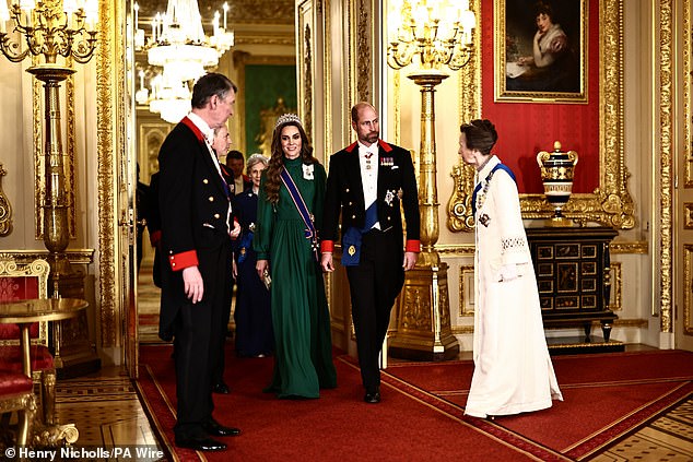 The Prince and Princess of Wales are greeted by the Princess Royal ahead of the meal