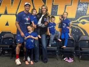 Toronto Blue Jays' Max Scherzer and wife Erika pose for a photo with their kids.