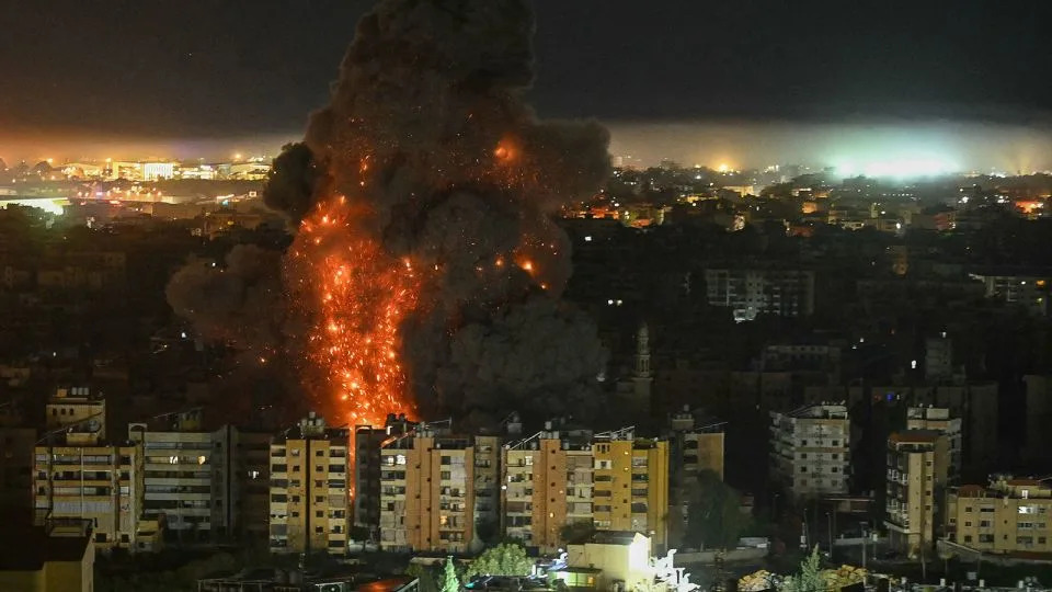 A fireball rises from the site of an Israeli airstrike that targeted an area in Beirut's southern suburbs overnight. - Fadel Itani/AFP/Getty Images