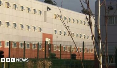The outside of HMP Parc with a fence seen around it.