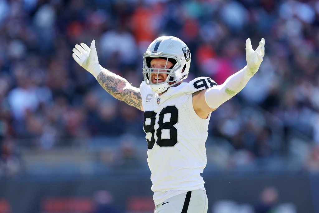Maxx Crosby #98 of the Las Vegas Raiders celebrates after a sack during the second quarter against the Chicago Bears at Soldier Field on October 22, 2023 in Chicago, Illinois. 