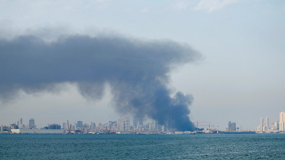 Smoke rises after reported Iranian missile attacks, following strikes by the United States and Israel against Iran, in Manama