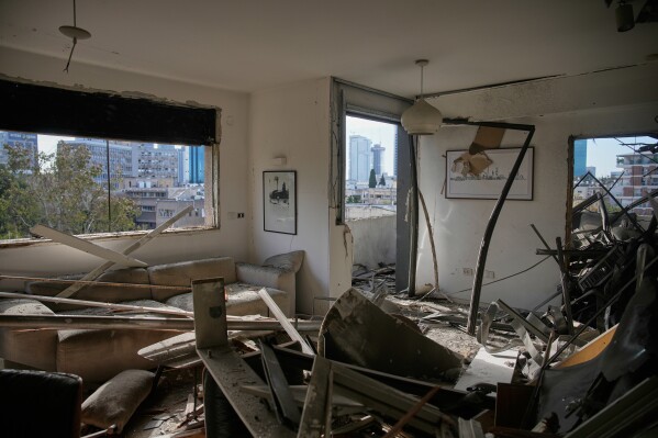 A damaged apartment is seen a day after it was struck by an Iranian missile in Tel Aviv, Israel, Sunday, March 1, 2026. (AP Photo/Ohad Zwigenberg)