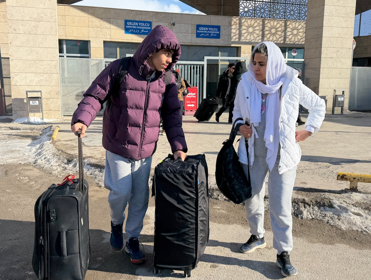 A young man who only wanted to be identified by Sam, at the Kapikoy border crossing with his mother after leaving the families home in Tabriz, in northern Iran.