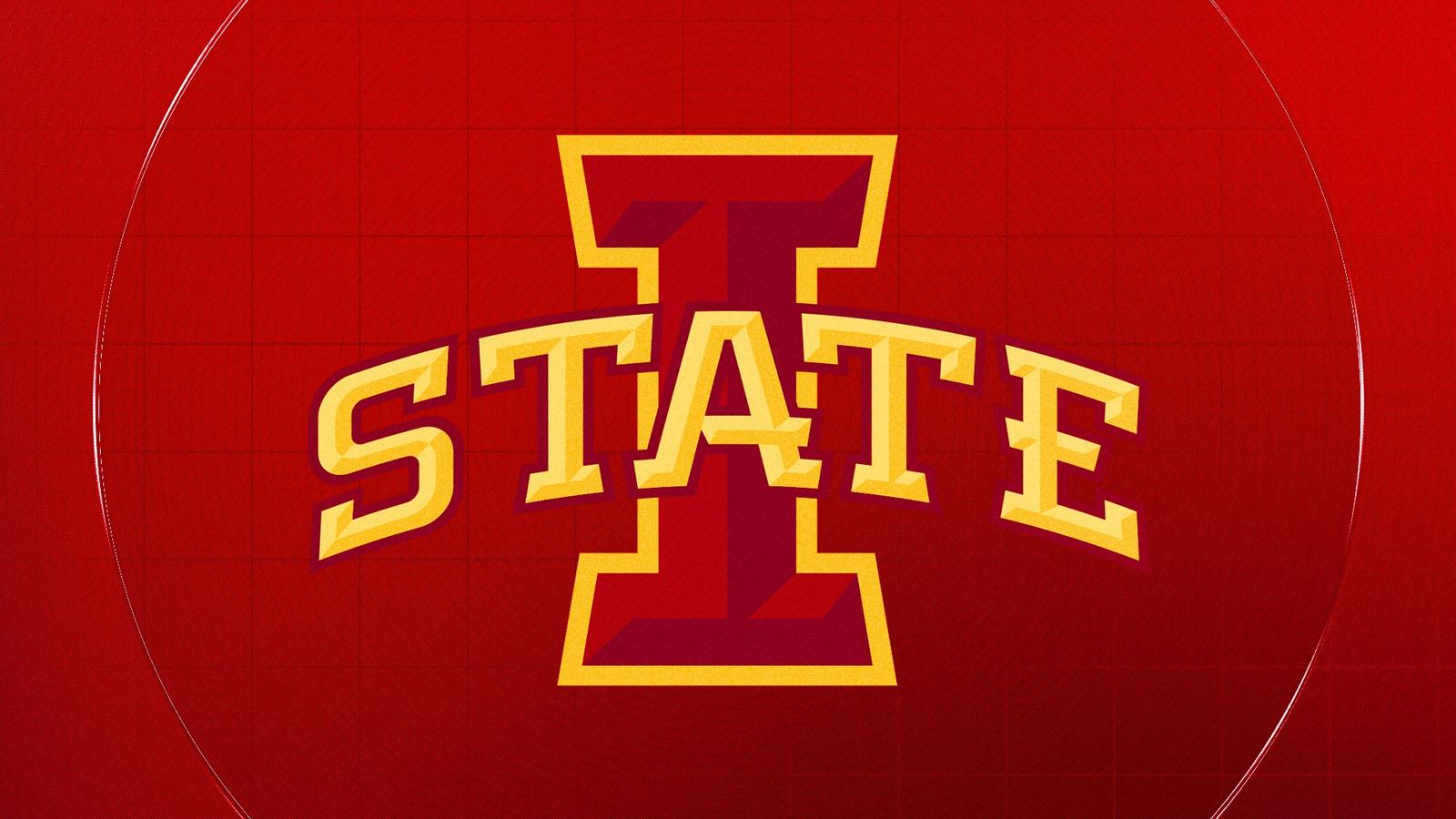 Ric and Carol Jurgens stand next to the athletics computer lab donning their name.