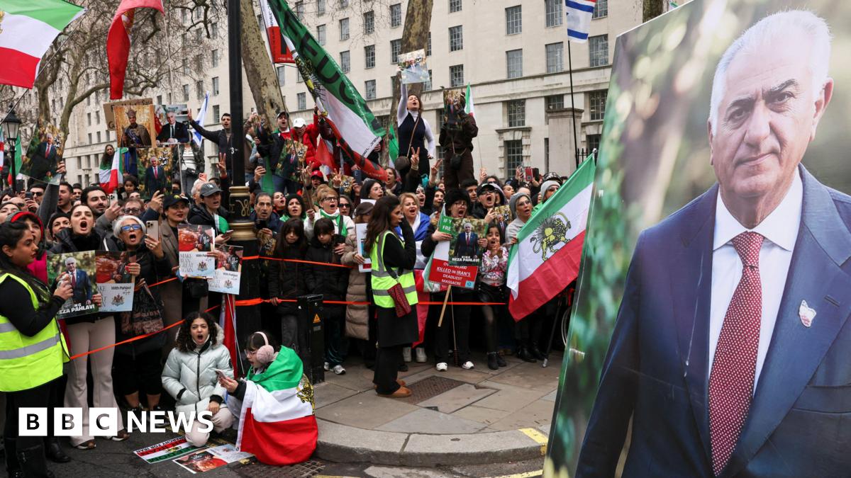 A large image of Reza Pahlavi, the exiled son of Iran's last shah, is displayed as people gather on Saturday, in London, Britain.