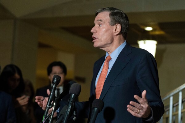 Senate Intelligence Committee Sen. Mark Warner, D-Va., speaks to reporters following a House and Senate Intelligence Committees briefing about the war in Iran at the Capitol in Washington, Monday, March 2, 2026. (AP Photo/Manuel Balce Ceneta)
