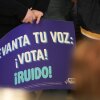 A person holds a blue sign saying in Spanish "Raise your voice: Vote" at a creator event for BOLD Democrats, a Hispanic PAC, in Houston on February 17.