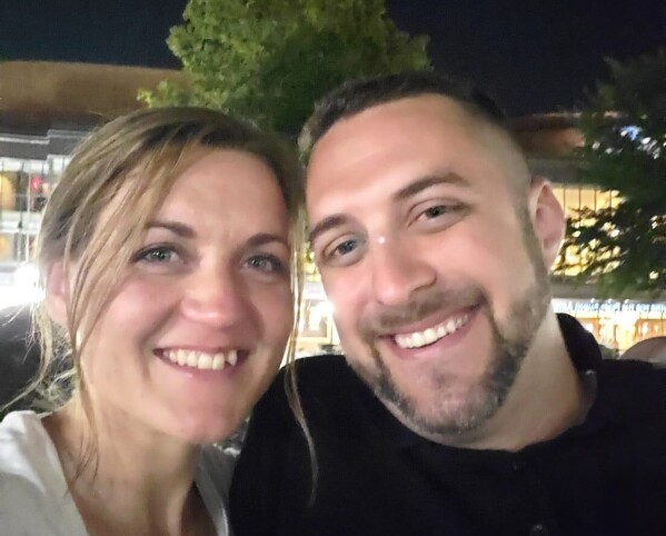 This undated photo provided by Joey Amor shows Nicole Amor, left, and Joey Amor smiling for a photo. (Joey Amor via AP)