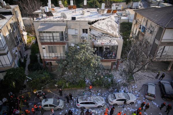 Officers from Israel's Home Front Command inspect a damaged apartment building after an Iranian missile strike in Ramat Gan, Israel, Tuesday, March 3, 2026. (AP Photo/Ohad Zwigenberg)
