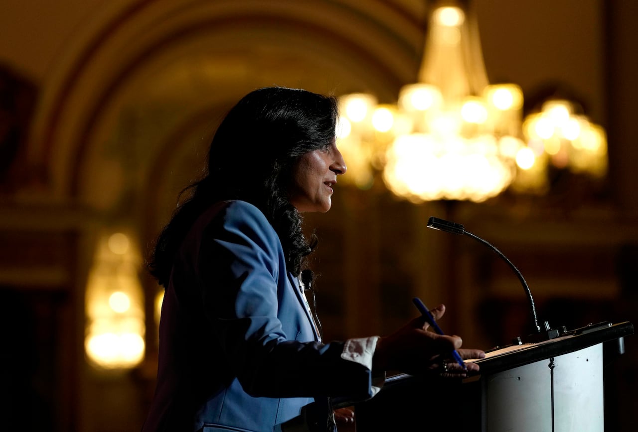 Anita Anand speaking at a microphone. 