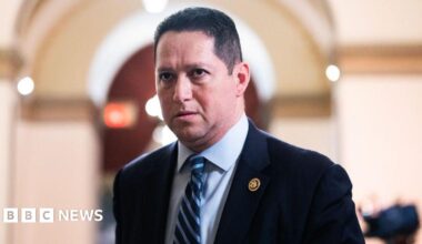 Tony Gonzales is seen in a suit and tie walking in the US Capitol