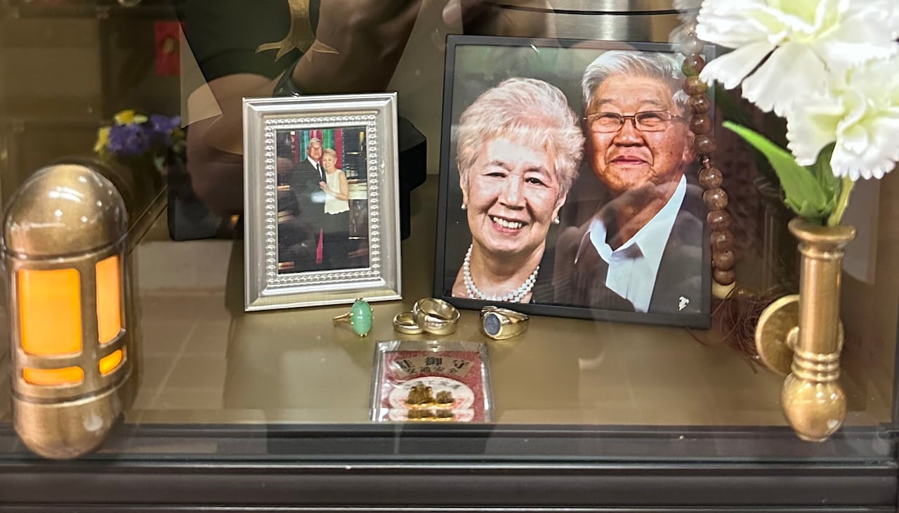 A photo showing the cremation niche belonging to Suzuko Mori and Shigeru Mori. The photo shows two turns and some valuables including two silver wedding rings. 