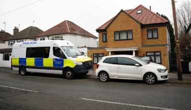 Police search a house in Watford after making a series of dawn arrests. Pic: PA