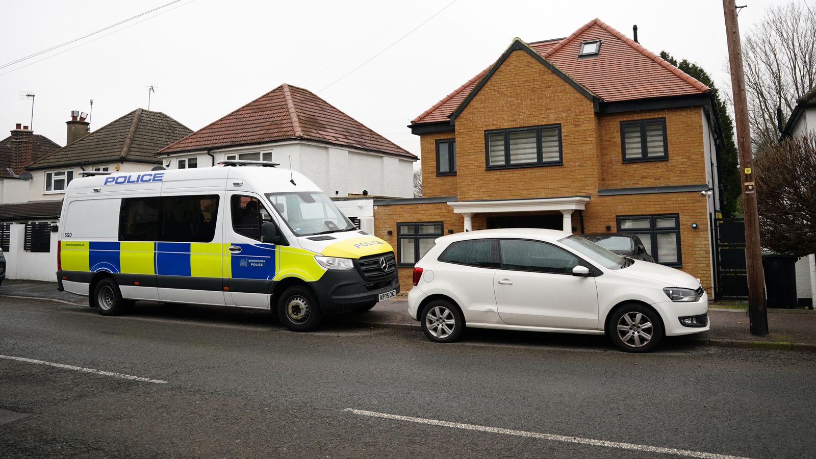 Police search a house in Watford after making a series of dawn arrests. Pic: PA