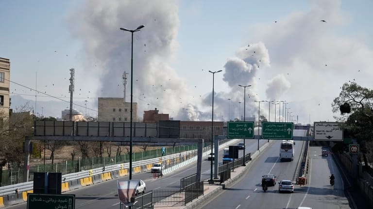 Plumes of smoke rise as strikes hit the city during...