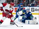Goaltender Kevin Lankinen (32) prepares to stop the Hurricanes' Jordan Staal (11) during the first period