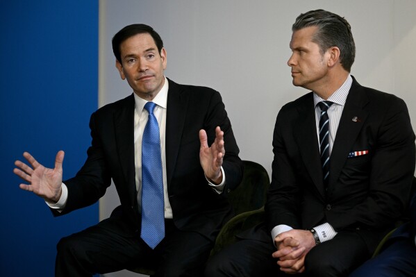 Secretary of State Marco Rubio, left, speaks next to Defense Secretary Pete Hegseth during a meeting between U.S. President Donald Trump with NATO Secretary General Mark Rutte at the NATO summit of heads of state and government in The Hague, Netherlands, June 25, 2025. (Brendan Smialowski/Pool Photo via AP, file)