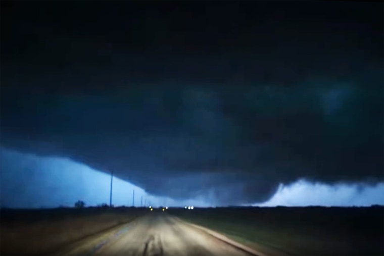 A large funnel cloud illuminated by lightning in Fairview, Okla., on Thursday.
