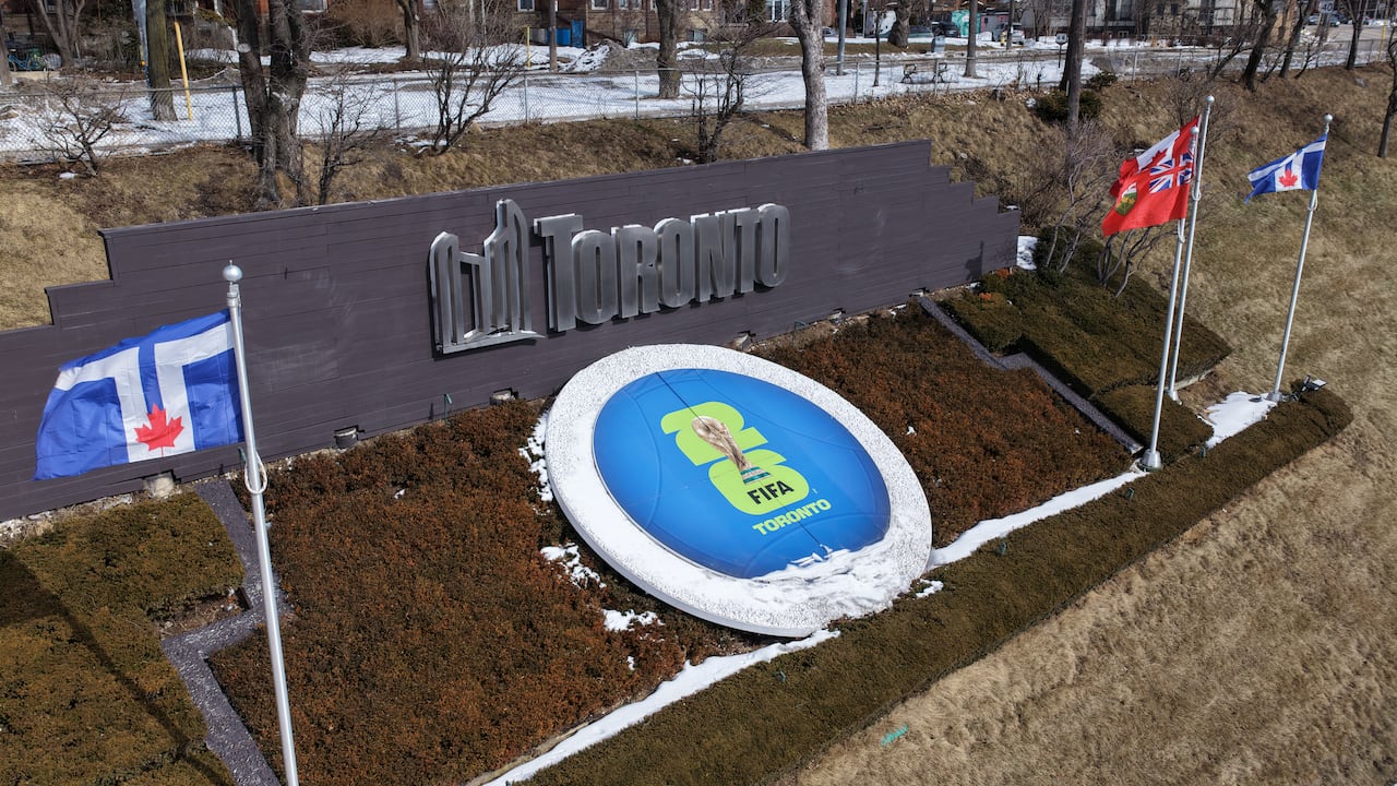 Toronto logo and FIFA logo on grassy area