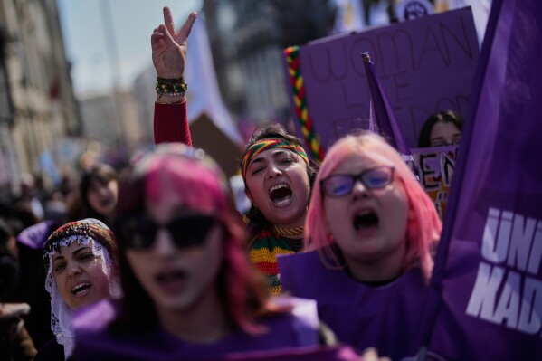 Women shout slogans as they march during a protest marking the International Women's Day, in Istanbul, Turkey, Sunday, March 8, 2026. (AP Photo/Khalil Hamra)