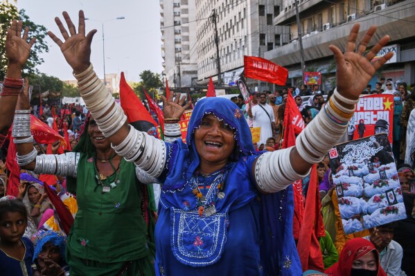 Women's right activists take part in a rally to mark International Women's Day, in Karachi, Pakistan, Sunday, March 8, 2026. (AP Photo/Ali Raza)