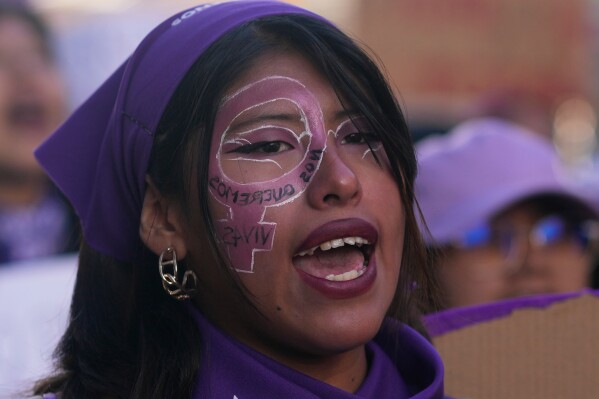 A woman shouts slogans during a march marking the upcoming International Women's Day, in La Paz, Bolivia, Friday, March 6, 2026. (AP Photo/Juan Karita)