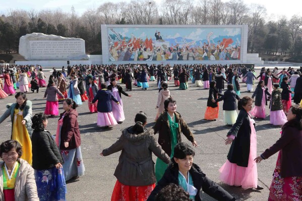 North Korean women dance on the occasion of the International Women's Day in Moranbong District, Pyongyang, North Korea Sunday, March 8, 2026. (AP Photo/Jon Chol Jin)