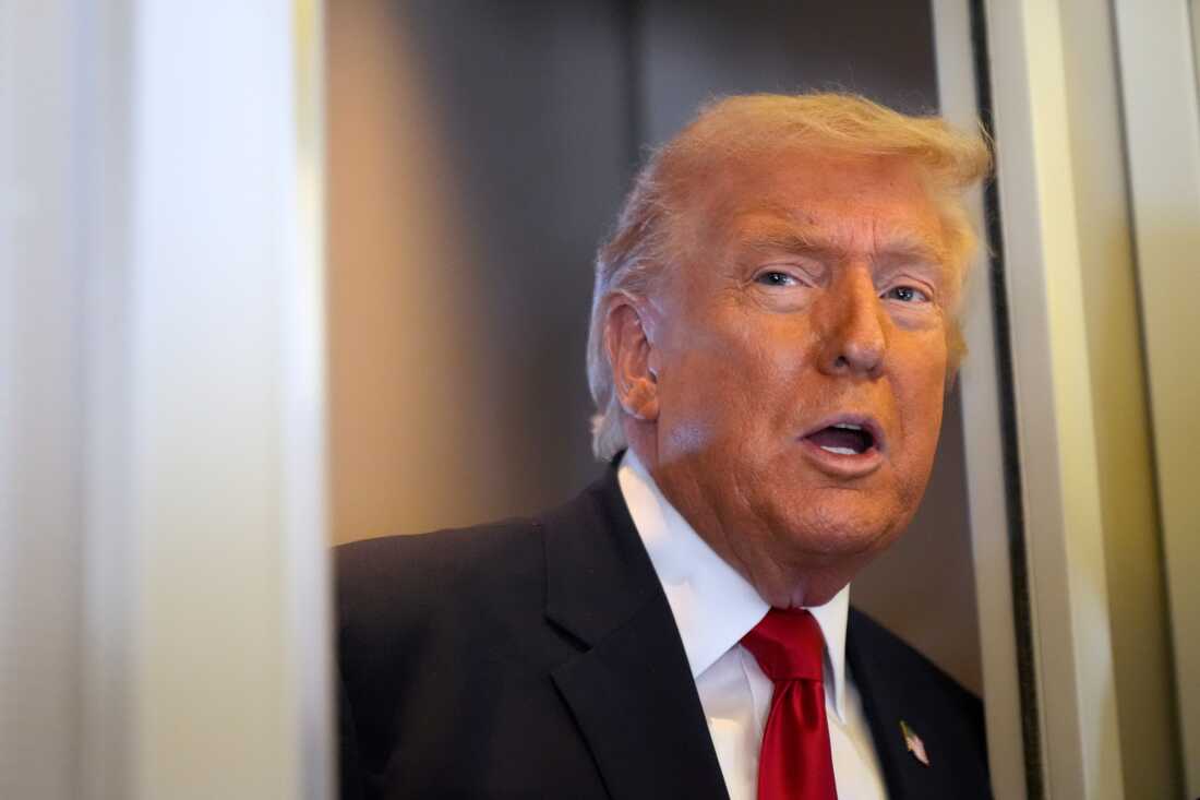 President Donald Trump speaks to reporters while traveling aboard Air Force One en route from Dover Air Force Base, Del., to Miami, Saturday, March 7, 2026. (AP Photo/Mark Schiefelbein)