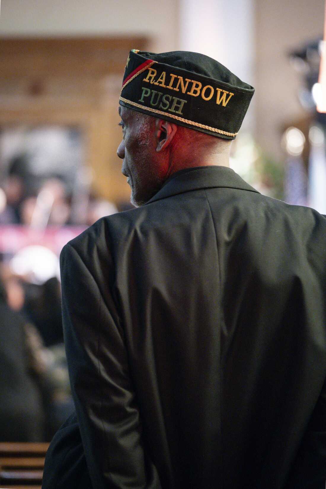 A member of the Rainbow PUSH Coalition stands during homegoing services honoring the Rev. Jesse Jackson on Saturday.