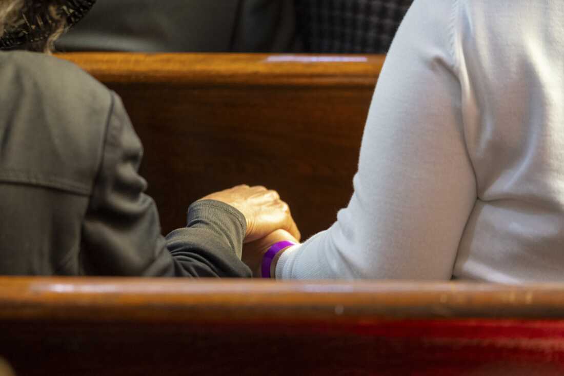 Supporters hold hands during a funeral service for the Rev. Jesse Jackson at the Rainbow PUSH Coalition.