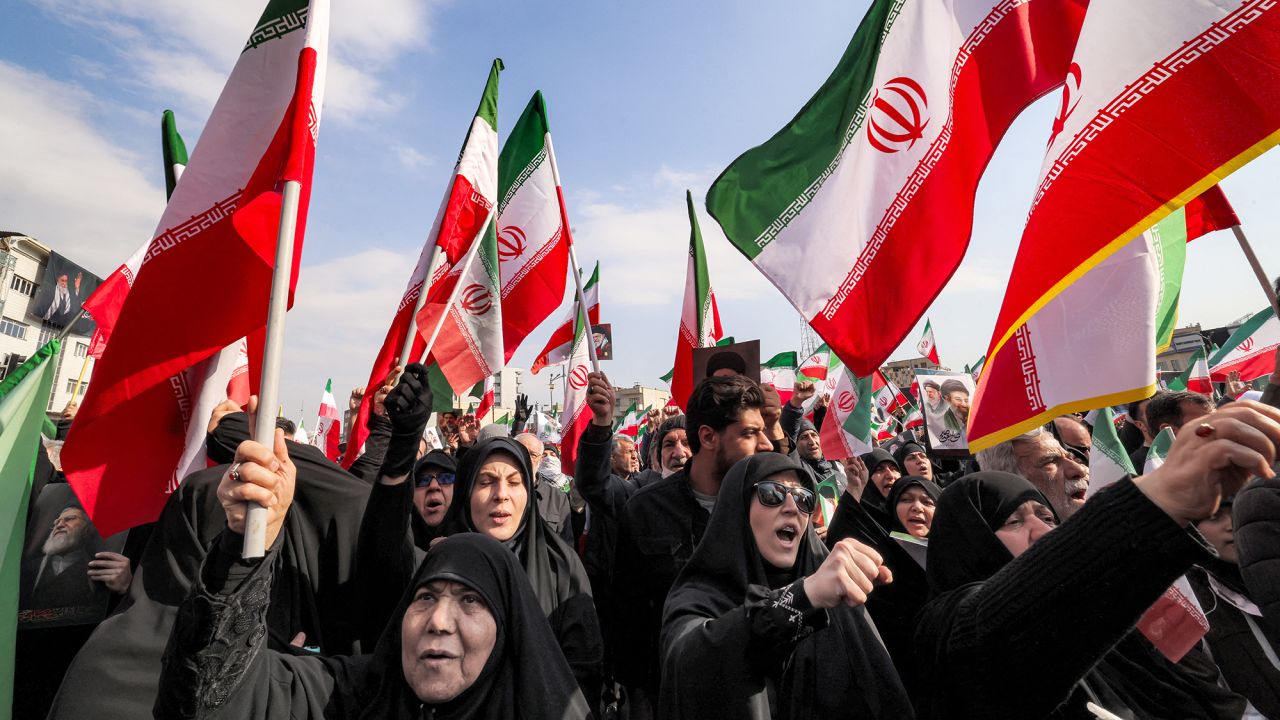 Demonstrators gather with Iranian national flags for a rally in support of the new Supreme Leader at Enghelab Square in central Tehran on March 9, 2026. Iran marked the appointment of Ayatollah Mojtaba Khamenei to replace his father as its supreme leader with a new barrage of missiles against Israel and the Gulf states on Monday, as the Middle East war sent oil prices soaring. (Photo by ATTA KENARE / AFP via Getty Images)